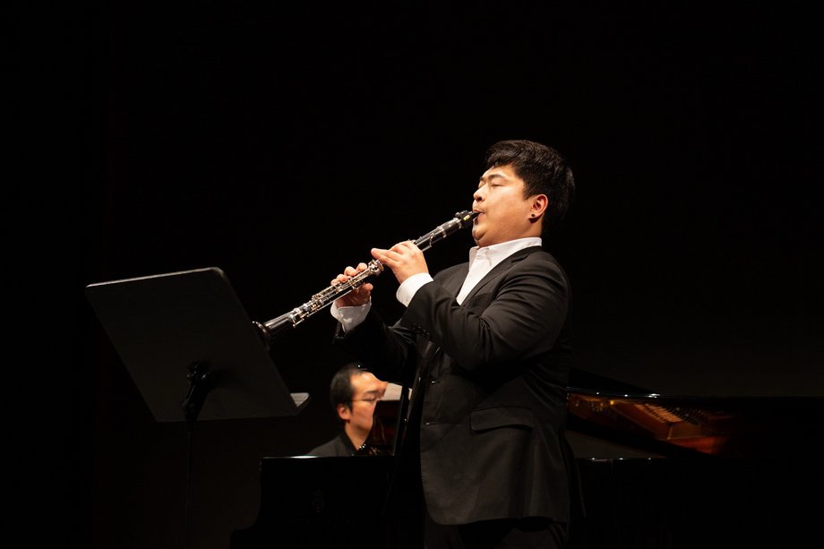 A man who plays the clarinet