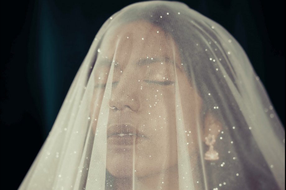 Portrait with a veil over the face