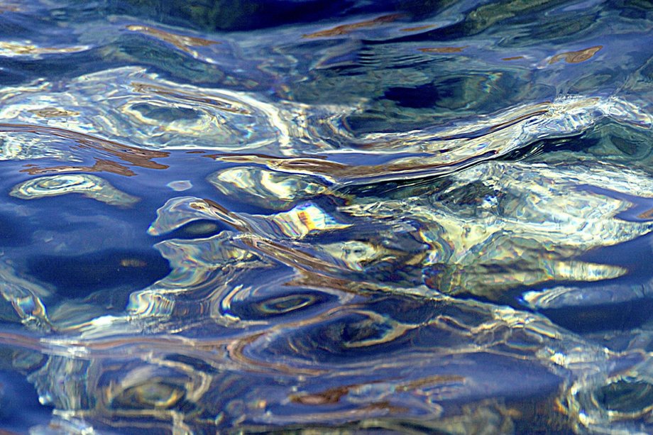 Reflective water surface with light waves